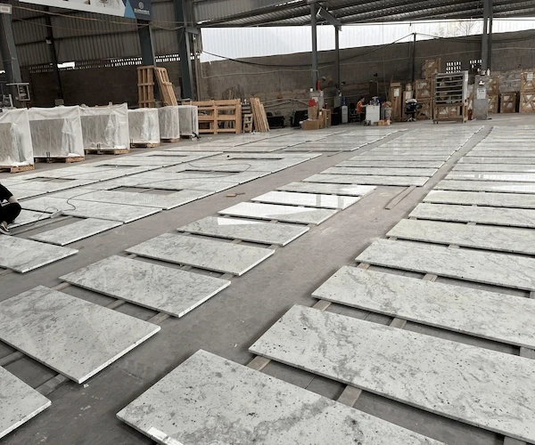 Andromeda White Granite Kitchen Top dry-laid countertop components aligned in a supplied factory reference image