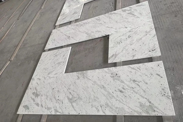 Andromeda White Granite Kitchen Top fabricated kitchen top pieces prepared for layout inspection in a supplied factory image
