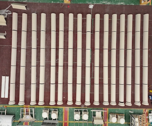 Rows of Beige Limestone fluted shaft sections arranged for dry-lay inspection