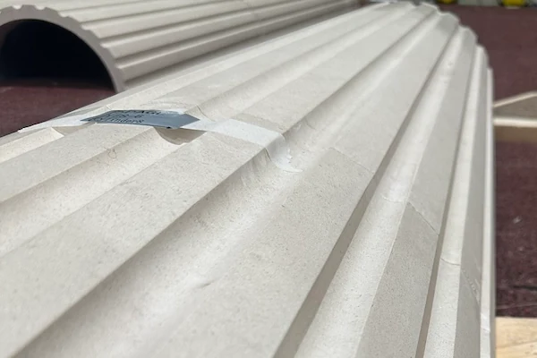 Beige Limestone fluted shaft pieces arranged for production review