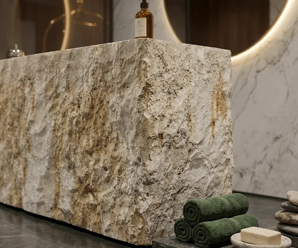 3D visualization of a beige limestone split-face reception desk in a calm interior concept