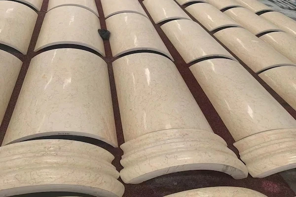 Polished Beige Marble column shafts and bases arranged for surface inspection