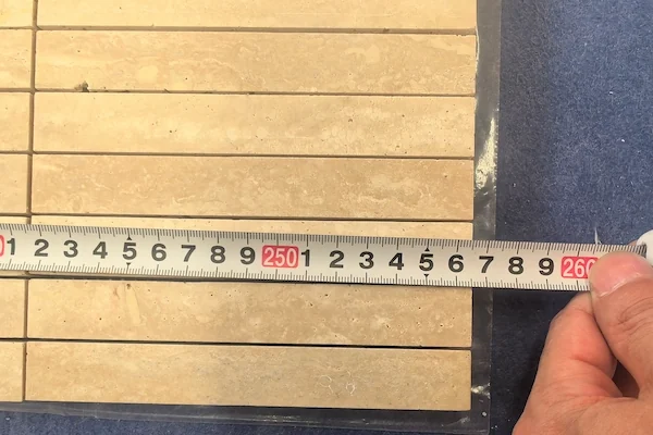 Beige Travertine Linear Mosaic strip module shown in a supplied dimension measurement reference image