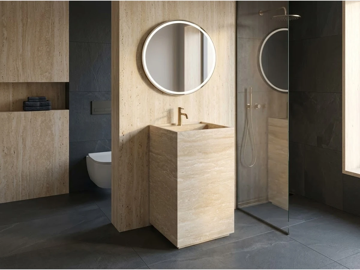 Freestanding rectangular beige travertine pedestal vanity with an integrated basin in a contemporary bathroom