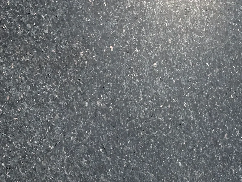 Black Galaxy Granite surface with a dark black field and fine light mineral flecks