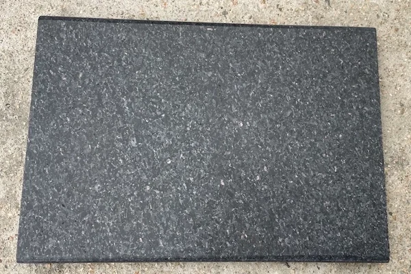 Honed Black Galaxy Granite tile shown in a supplied dry-lay production reference