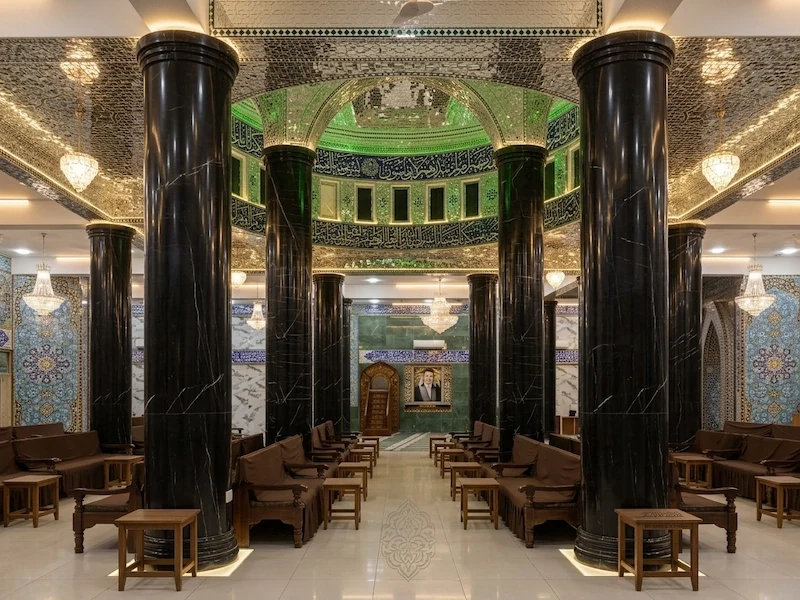 Polished Black Marble cylindrical columns with pale linear veining in a supplied interior architectural reference