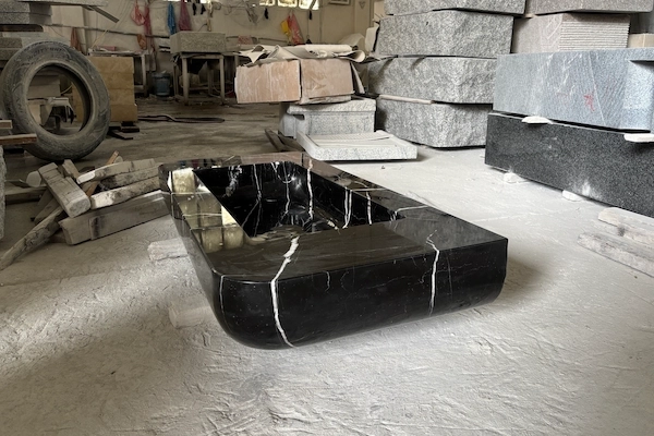 Supplied polished Nero Marquina vanity surface reference during gloss and measurement inspection