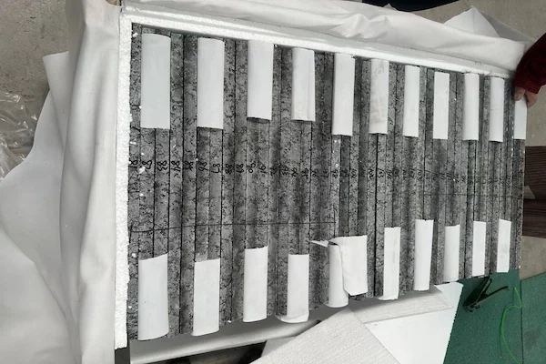 Butterfly Green Granite material prepared for handling in a supplied workshop reference