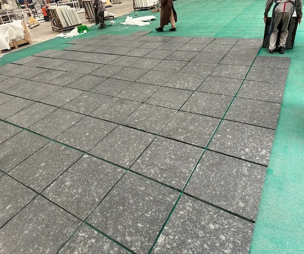 Butterfly Green Granite tiles arranged for dry-lay review in a supplied factory image
