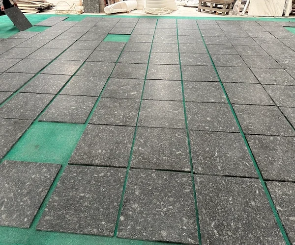 Butterfly Green Granite flooring pieces shown in a supplied factory quality-control reference
