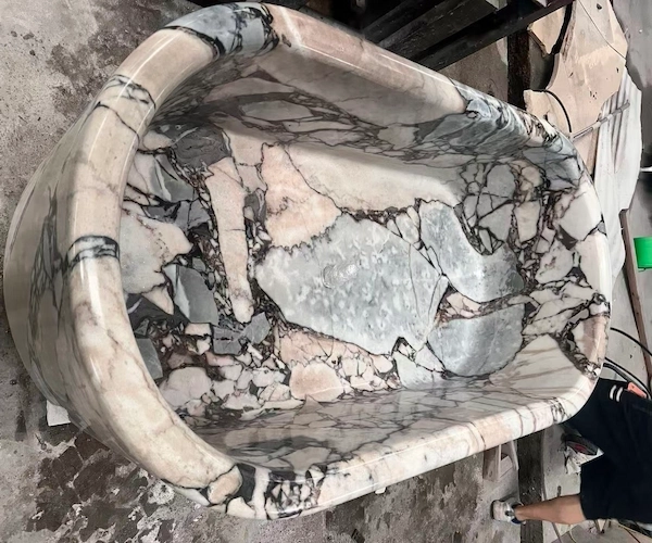 Supplied overhead workshop reference showing the oval interior profile of a Calacatta Viola marble bathtub