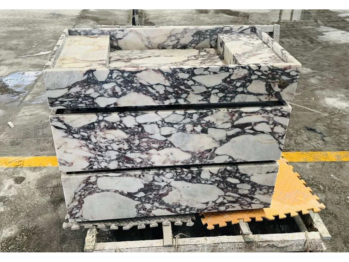 Calacatta Viola marble vanity front and mitred edge checked during workshop fabrication