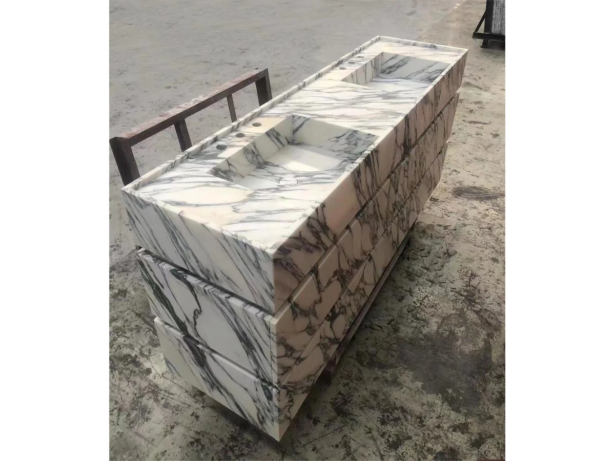 Wall-mounted Calacatta Viola marble double vanity drawer alignment reviewed during workshop assembly