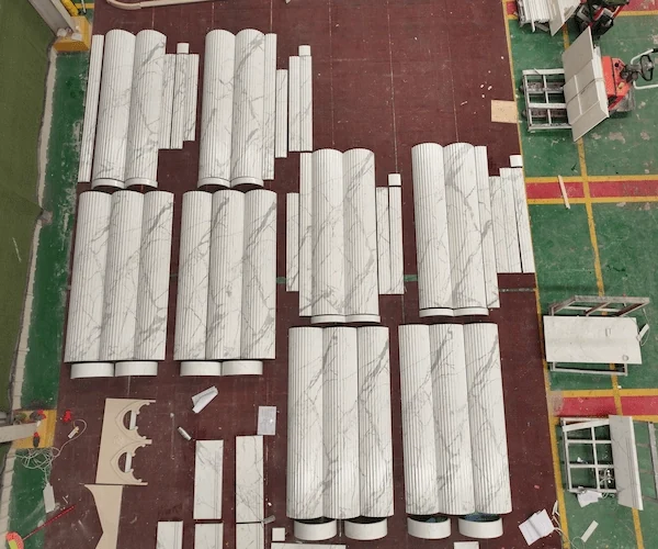 Calacatta White Marble fluted shafts bases and capital components in a factory component layout