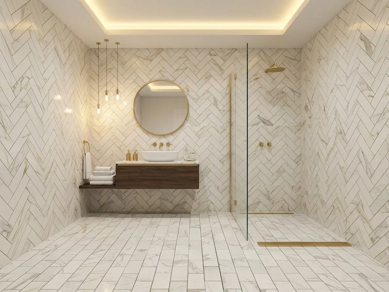 Calacatta White Marble Mosaic Tile shown in a supplied bathroom application reference with white veined mosaic wall and floor surfaces