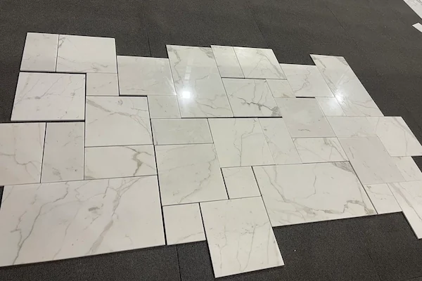 Calacatta White Marble Mosaic Tile dry-laid mixed-size marble pieces shown in a supplied production layout reference