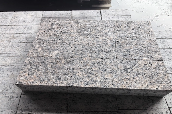 Caledonia Brown Granite granite cube stone slab during calibration and sizing quality control
