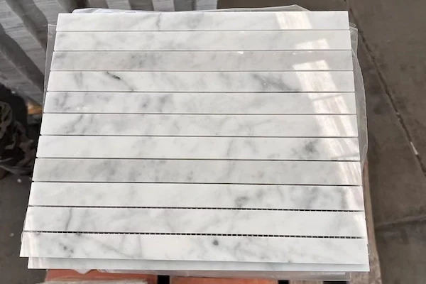 Carrara White Linear Strip Marble Mosaic stone pieces shown in a supplied vein matching review image