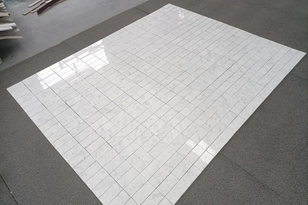Carrara White Marble Mosaic Tile polished linear marble mosaic modules shown in a supplied surface review image