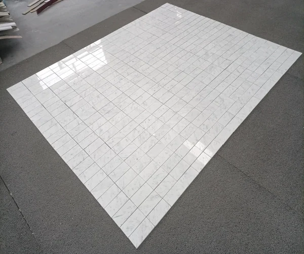 Carrara White Marble Mosaic Tile pale marble mosaic pattern layout shown in a supplied factory review image