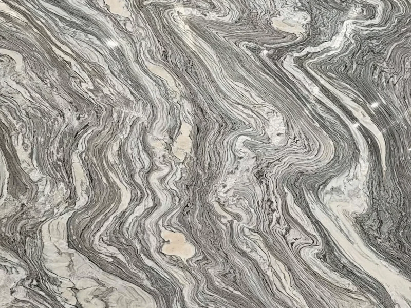 Cipollino Marble slab surface with flowing grey-green layered veining and warm mineral accents