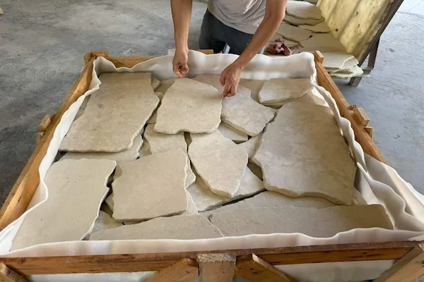 Crazy Paver Limestone loose irregular limestone pieces in a supplied material-handling reference
