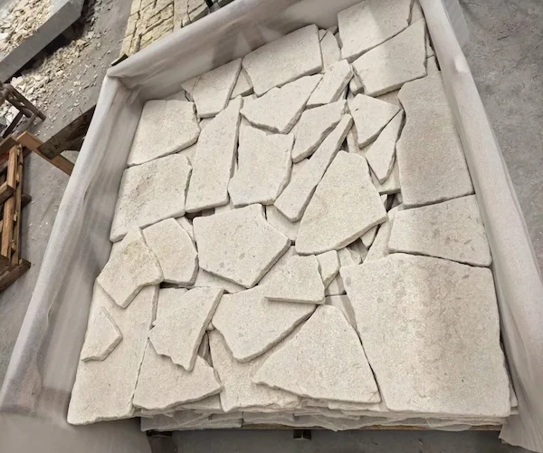 Crazy Paver Limestone pale irregular stone pieces shown in a supplied crated-material reference