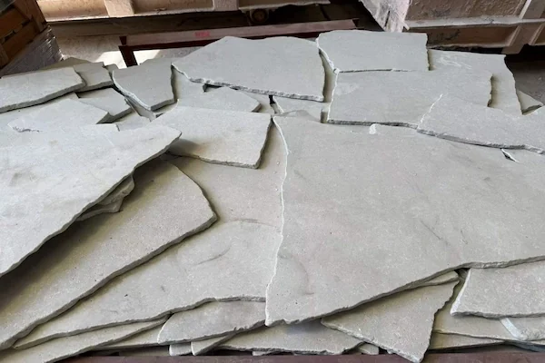 Crazy Paving Travertine Floor Tile loose pale travertine pieces shown in a supplied material-handling image