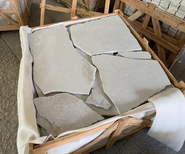 Crazy Paving Travertine Floor Tile irregular pale travertine pieces shown in a supplied material-handling reference
