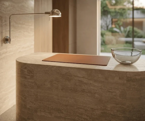 3D visualization of a curved travertine concierge desk in an entry concept