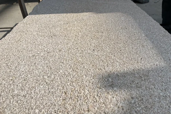 G606 Light Rusty Granite bush-hammered surface shown in a supplied material detail