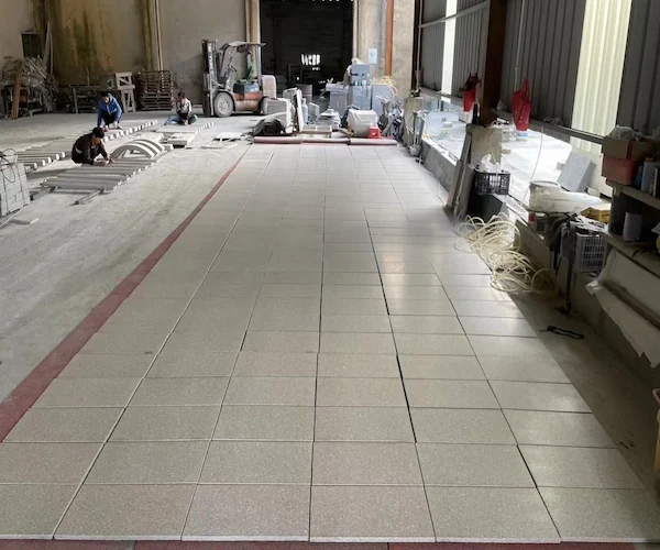 G606 Light Rusty Granite tiles arranged for dry-lay review in a supplied factory image