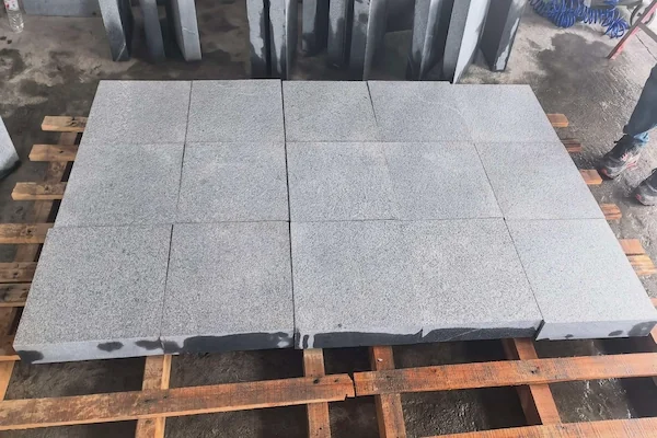 G654 Dark Grey Granite flamed pavers shown in a supplied production reference