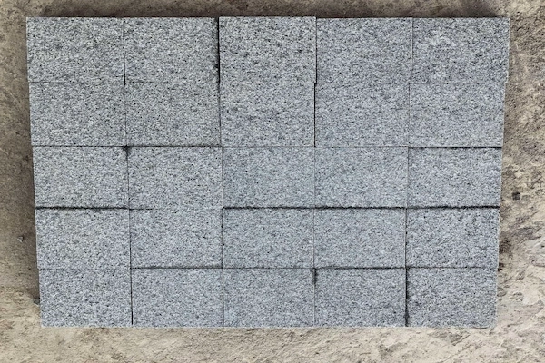 G654 Granite Cube Stone units assembled in a rectangular layout for joint alignment review