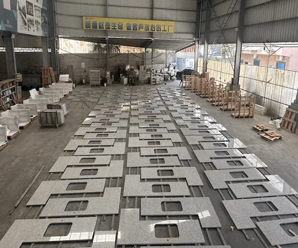 G655 Hazel White Granite Kitchen Top cut-to-size kitchen top components sequenced on a factory floor in a supplied fabrication reference