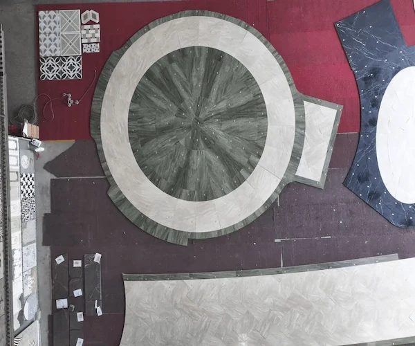 Overhead waterjet layout reference with a circular Green Granite pattern and pale stone border