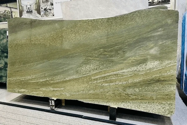 Green Granite slab on an inspection rack showing darker directional mineral bands