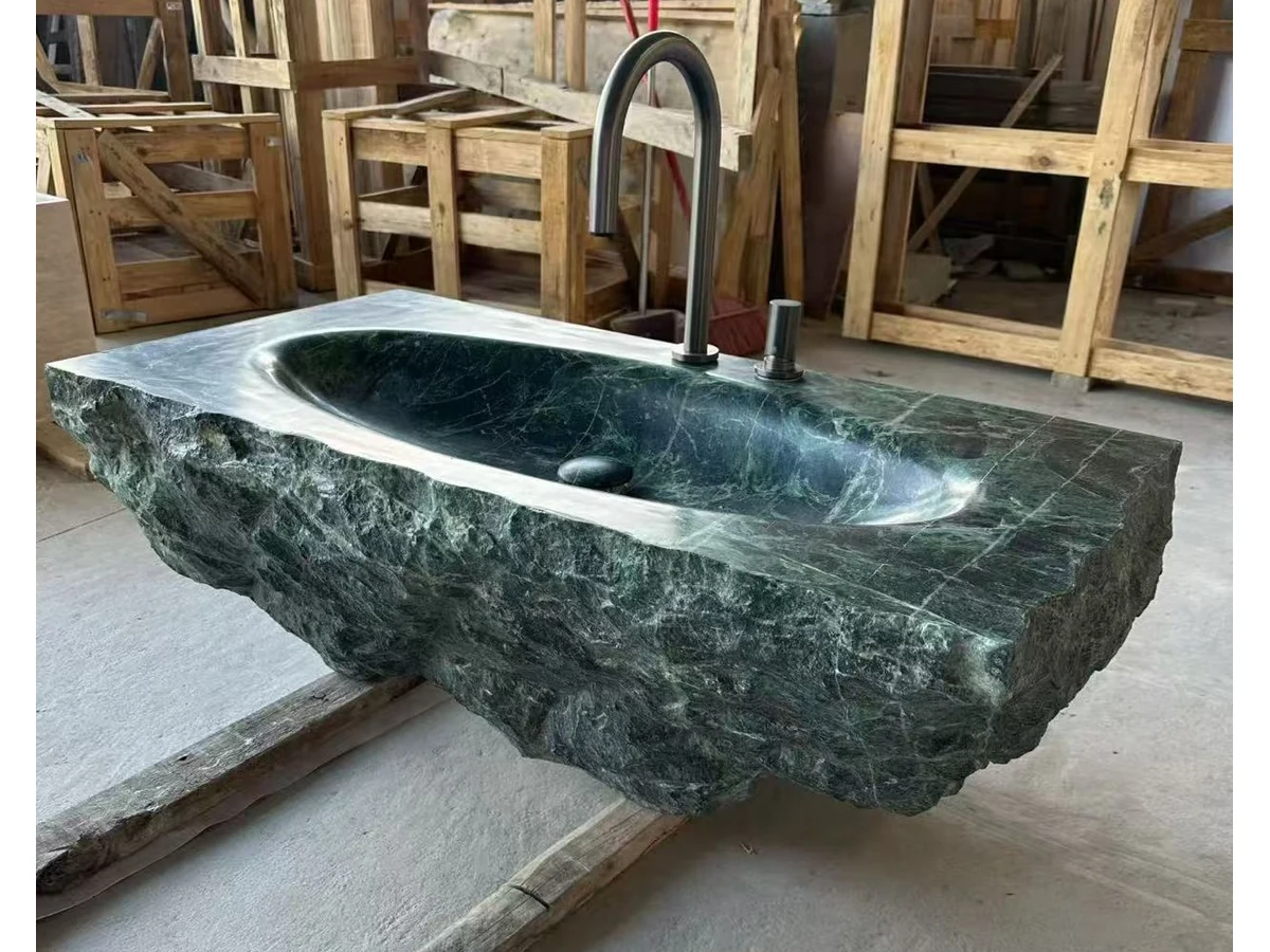 Green marble natural split-face texture reviewed during vanity fabrication inspection