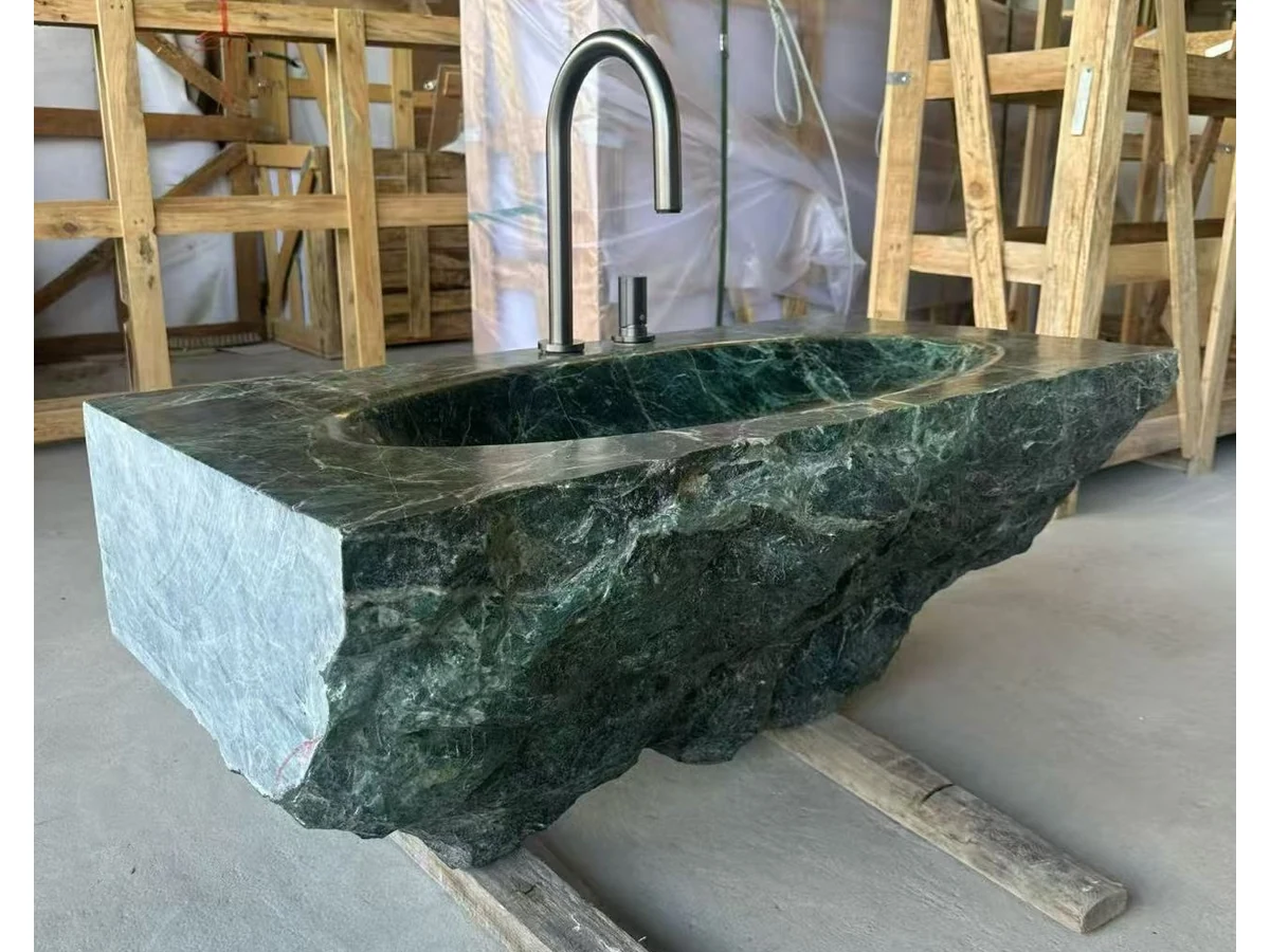Polished green marble vanity basin surface checked during workshop quality review
