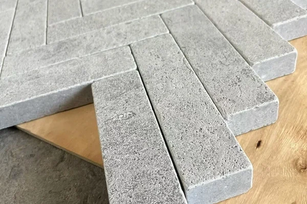 Grey Marble Herringbone Mosaic module arrangement shown in a supplied surface finish review image