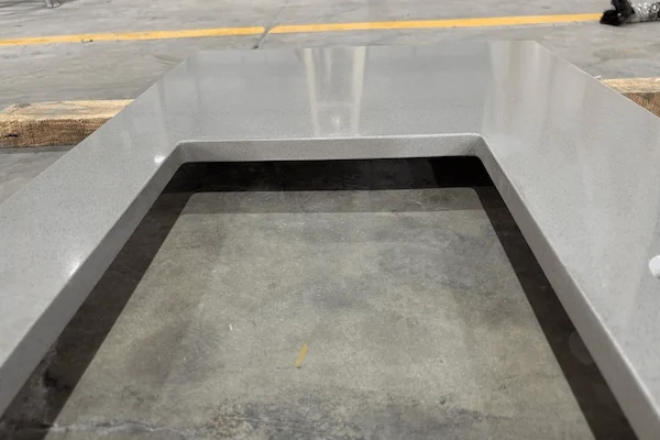 Grey Quartz Vanity Top fabricated vanity component shown for cut-out and surface-detail review in a supplied factory image