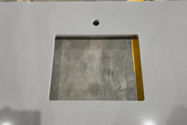 Grey Quartz Vanity Top cut-out and faucet-opening detail shown in a supplied production reference image