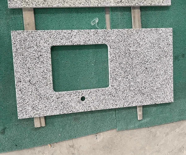 Jilin White Granite Vanity Top cut-out vanity top components arranged in a supplied factory fabrication reference
