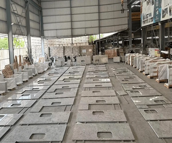 Kashmir White Granite Kitchen Top cut-to-size kitchen top components sequenced on a factory floor in a supplied fabrication reference
