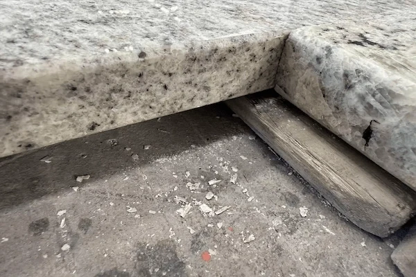 Kashmir White Granite Kitchen Top cut-to-size countertop panel with a sink cut-out in a supplied factory fabrication image