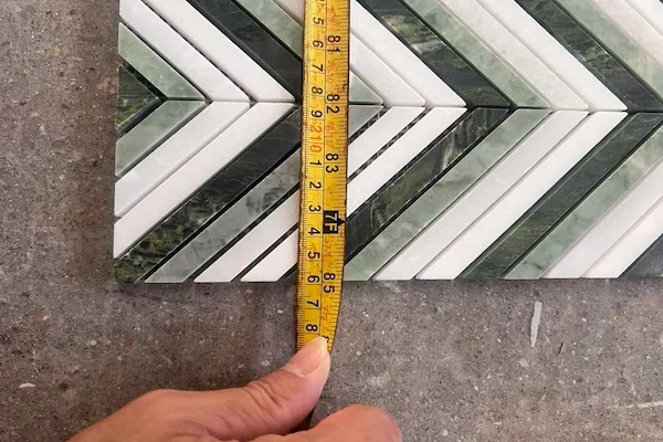 Kilkenny Chevron Marble Mosaic stone pieces shown in a supplied stone tone & vein review image