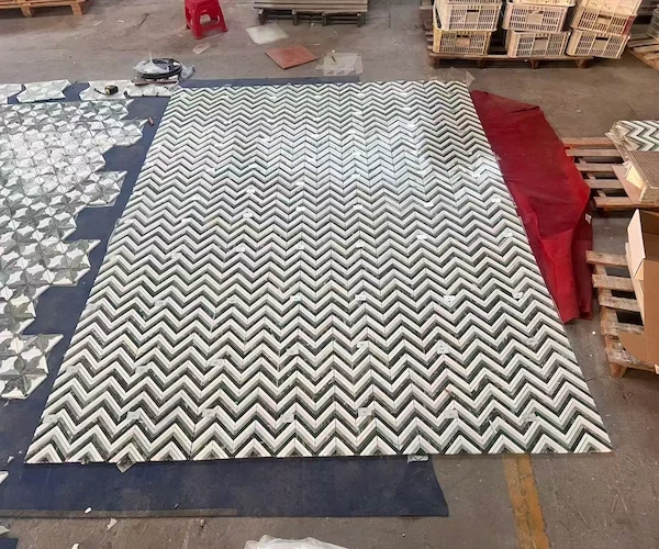Kilkenny Chevron Marble Mosaic sheets shown in a supplied surface flatness reference image