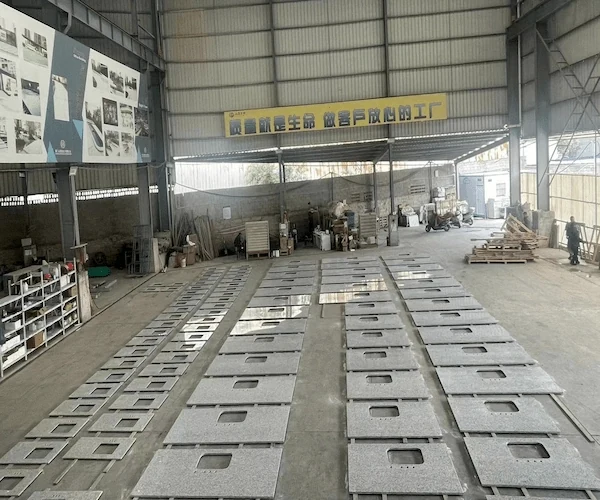 Light Grey Granite Kitchen Top cut-to-size kitchen top components sequenced on a factory floor in a supplied fabrication reference