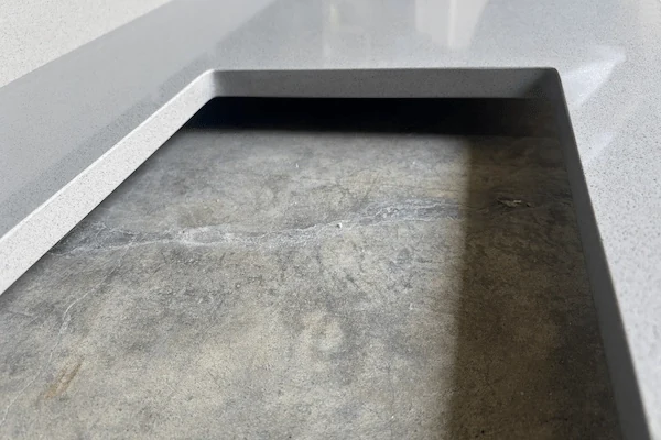 Light Grey Quartz Kitchen Top cut-to-size countertop panel with a sink cut-out in a supplied factory fabrication image